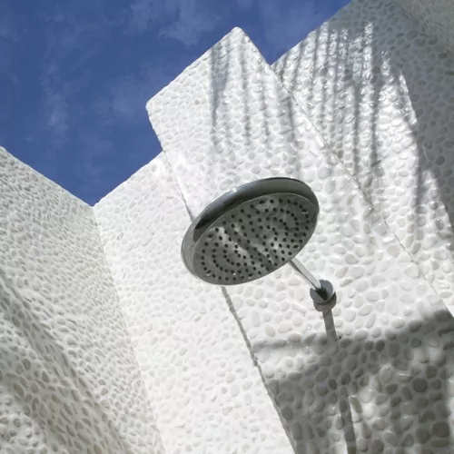 Luxurious outdoor shower at a honeymoon resort in Indonesia, offering a romantic and serene experience for couples