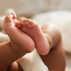 Close-up of baby feet symbolizing gentle moments from a babymoon in Lombok